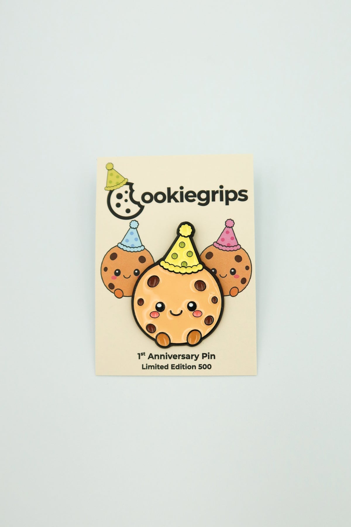 cookiegrips 1st Anniversary Enamel Pin on its Limited Edition 500 backing card