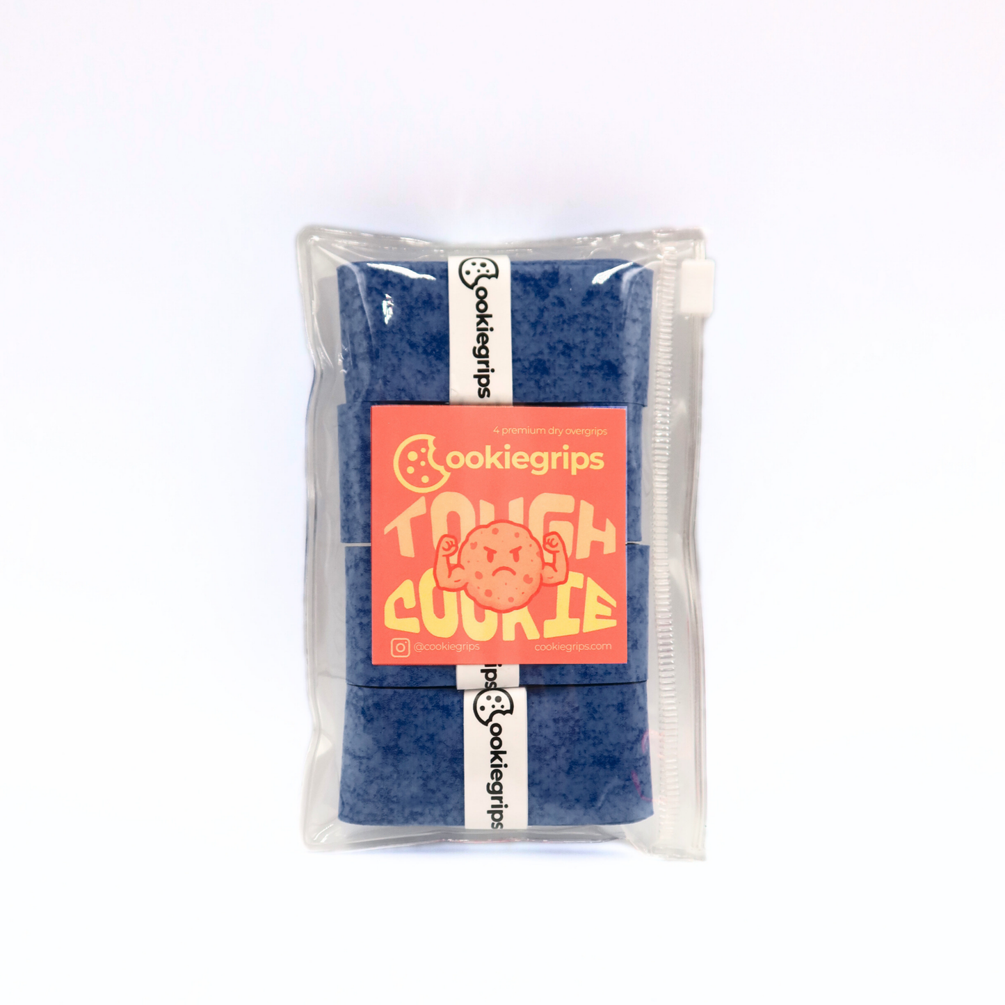 Cookiegrips Tough Cookie overgrip 4-pack in speckled dark blue, packaged in a clear zip pouch with peach label featuring a flexing cookie mascot.