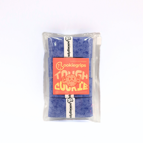 Cookiegrips Tough Cookie overgrip 4-pack in speckled blue, packaged in a clear zip pouch with peach label featuring a flexing cookie mascot.