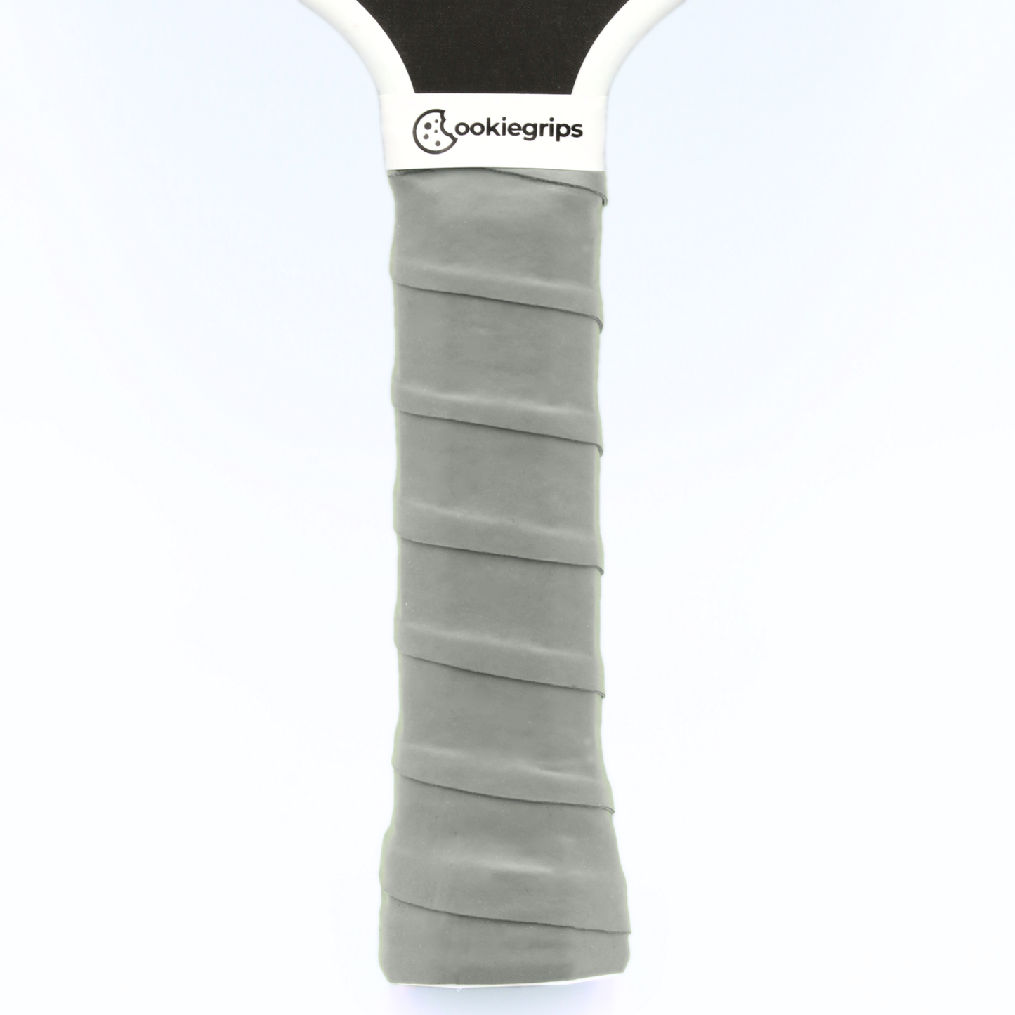 grey cookiegrips pickleball paddle overgrip – soft tacky overgrip applied to paddle handle for comfort and control.
