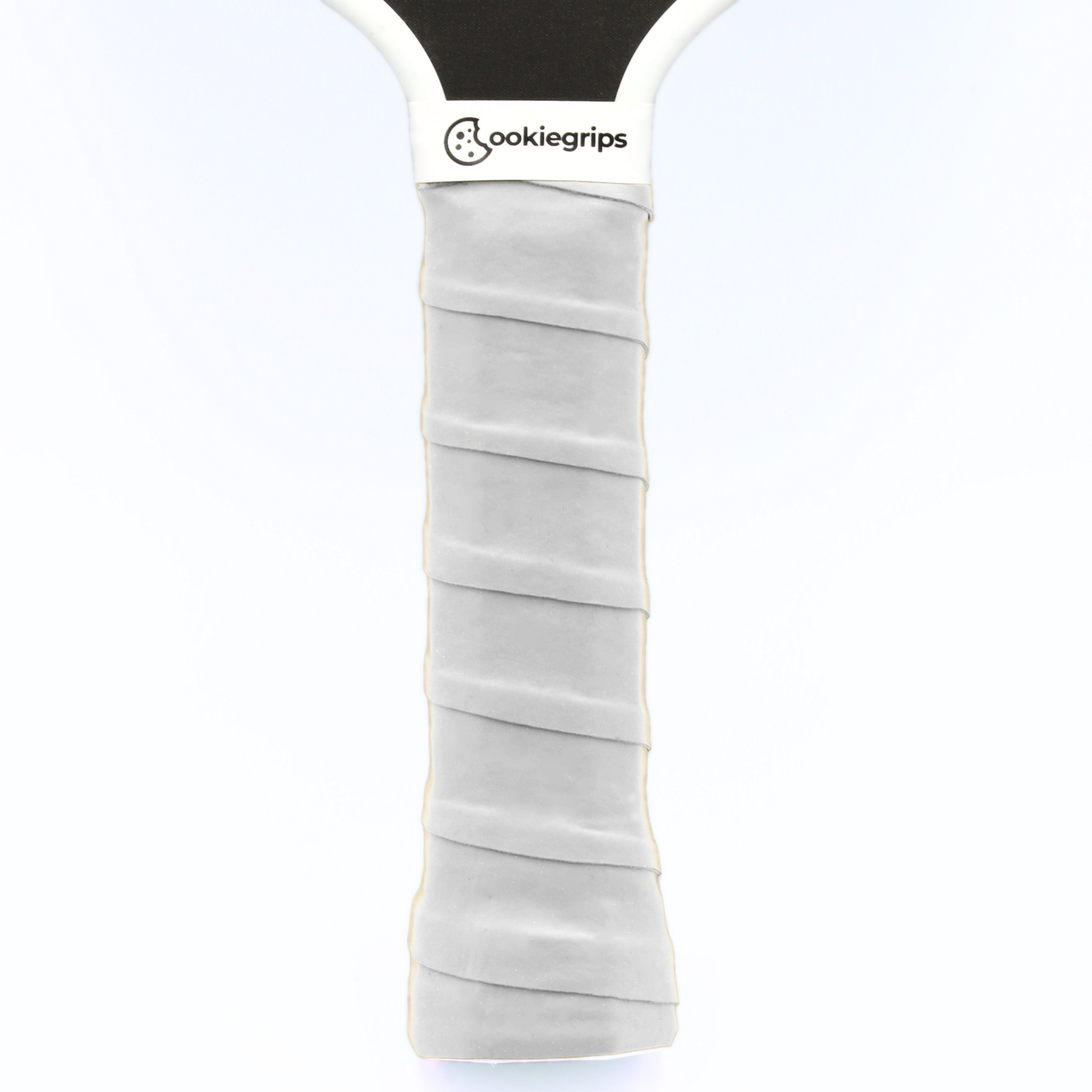 cookiegrips white pickleball overgrip wrapped on paddle handle — tacky grip tape for comfort and control.